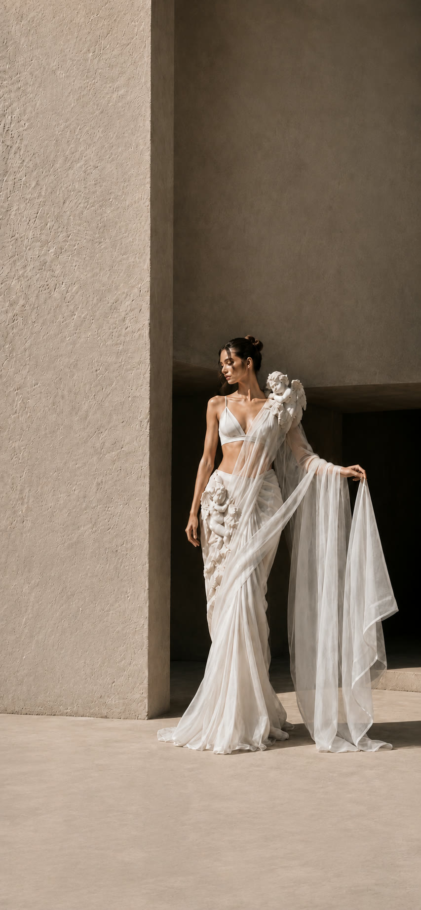 Tulle drape with sculpted cherubs