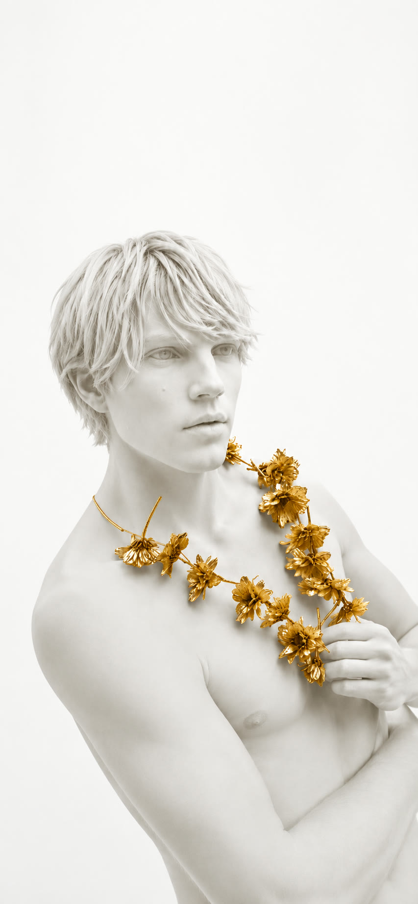 Gilded flower necklace on marble figure